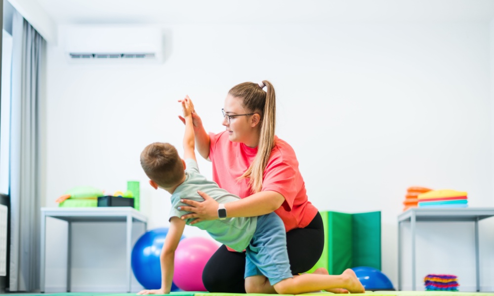 physical therapist playing with child