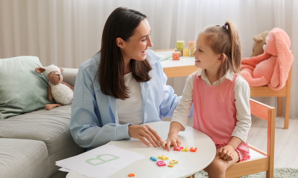 speech therapist working with little girl